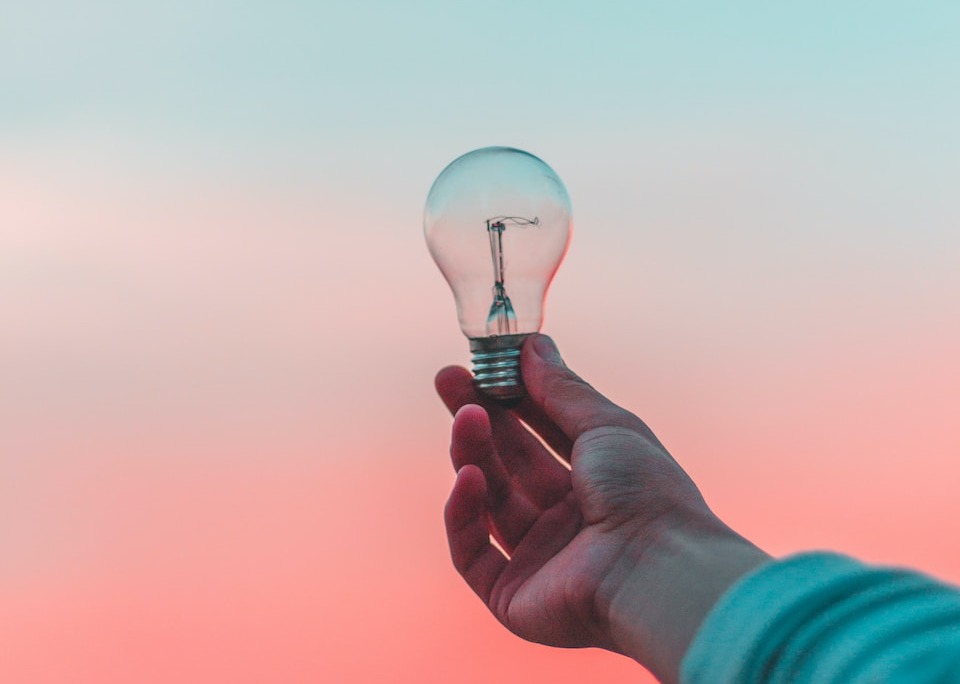 person holding light bulb