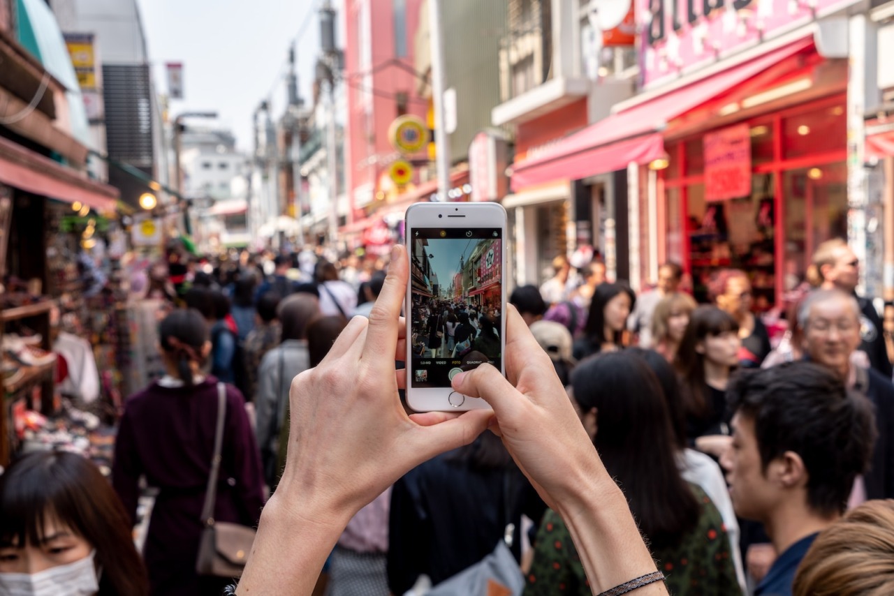 person taking a photo of people