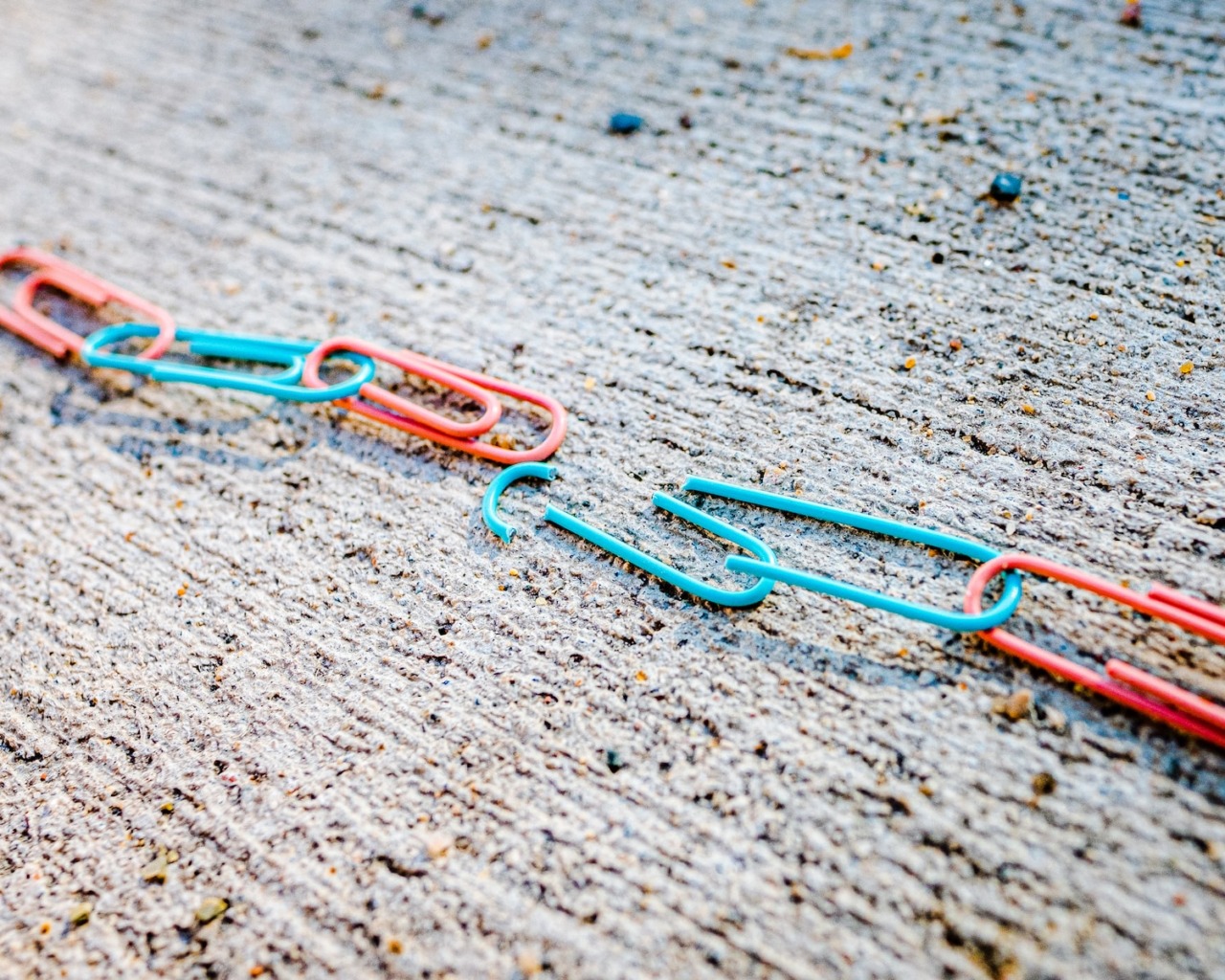 blue green and red plastic clothes pin