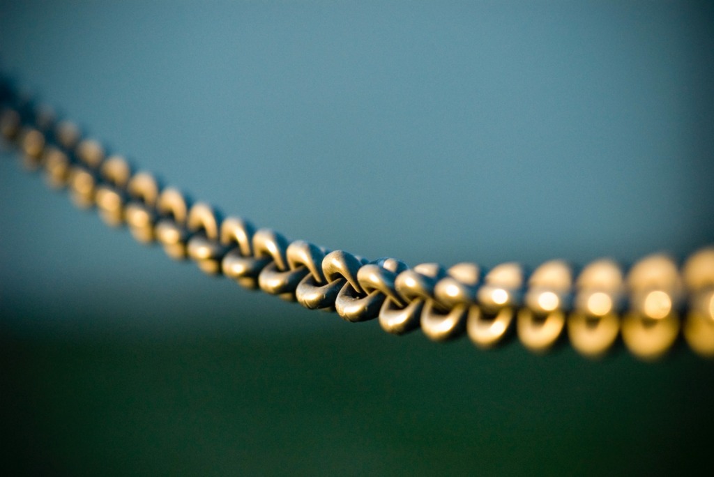 tilt shift photography of gray steel chains