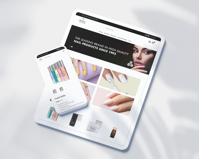 Tablet en smartphone met een website met Nail Creation-producten, waarop verschillende nagellakken, gereedschappen en manicure-gerelateerde artikelen worden getoond.