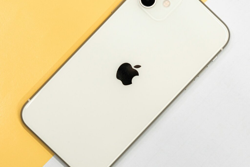 silver iphone 6 on white table
