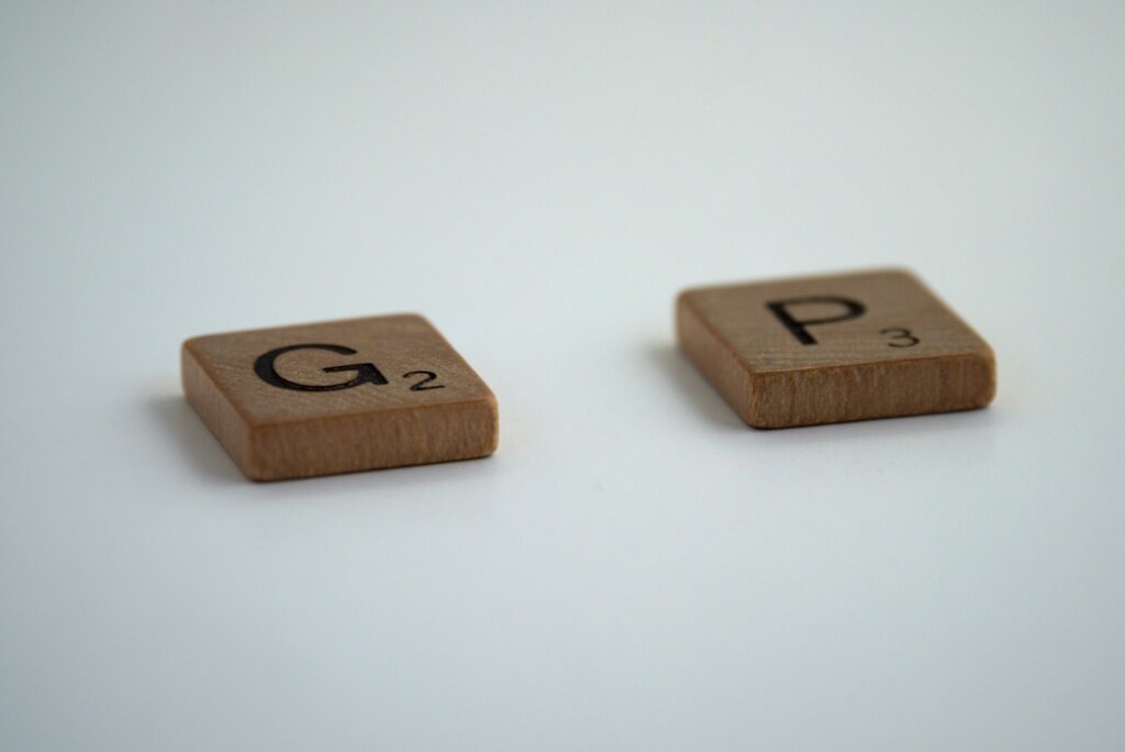 brown wooden dice on white surface