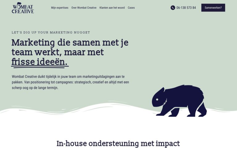 Websiteheader voor Wombat Creative met marketingtekst en een silhouet van een wombat op een lichtgroene achtergrond.